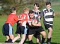 TRYING TO MAKE PROGRESS . . . Charlie Whitfield (Failsworth) has the ball in his possession during a match against Saddleworth