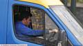 EYES off the road . . . this driver can't tear himself away from his phone on Oldham Way