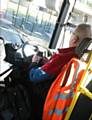 CAUGHT on camera . . . the bus driver uses his phone at the wheel