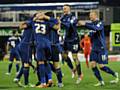 GREAT GAME . . . Carl Winchester (second right) joins in the celebrations after Reece Wabara's goal against Liverpool in the FA Cup