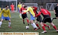 MAKING HIS PRESENCE FELT: Royton’s Alan Beckett (centre) is in the thick of the action against Hindsford.