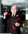 Saddleworth Museum and Gallery, ceremonial opening, Uppermill, Oldham. Sir, Norman Stoller, cutting the ribbon.