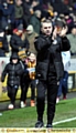 WELCOME BACK . . . John Sheridan applauds what was a terrific reception from Athletic fans as he heads for his technical area at Valley Parade.