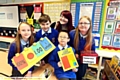 talented mathematicians (from the left) Malia Fotheringham, Josh Goodall, Aidan Tang and Chloe Turver, with Laura Male from Explore Learning.