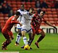 IN THE THICK OF THE ACTION . . . Athletic winger Ryan McLaughlin has a battle on his hands as he tries to charge forward