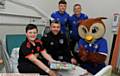 ON the ward . . . Danny Delaney, from Holts, with Stephen Robinson, Jamie Stott, Brian Wilson and Chaddy the Owl