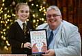 CHRISTMAS card winner . . . Evie Kinghorn with Councillor Sykes