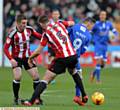 IT'S BEHIND YOU...Athletic forward Billy Mckay and Sheffield United defender Jack O'Connell battle for the ball