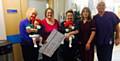 ALL smiles . . . (from left) grandma Libby Woodcock with Lilly Worrall, consultant neonatologist Natasha Maddock, mum Lauren Flight with Millie Worrall, sister Caroline Looby and health care assistant James Antrobus