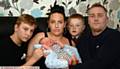 SHOCKED . . . (from left) Lewis Jackson, new baby Noah Jackson, mum Kelly Renton, Baily Jackson and dad Michael Jackson