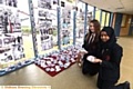 pupils Grace Lowe and Tahmina Ali with paper shoes which formed part of a display at Holocaust memorial display at Radclyffe School