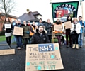 WALKOUT . . . Dr Rory Hicks and supporters outside the Royal Oldham Hospital