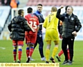 FAN SALUTE . . . John Sheridan acknowledges the travelling army.