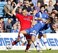 ONE TO WATCH . . . prolific midfielder Bradley Dack, pictured tangling with Athletic skipper Liam Kelly during the 3-3 draw at Gillingham earlier this season, has already found the net 15 times this term.