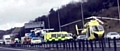 An air ambulance lands on the motorway to take the lorry driver to hospital