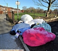 WHAT a mess . . . a mountain of rubbish dumped in Chadderton