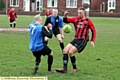 ACTION STATIONS . . . Limeside’s Jerome Slicker (red shirt) gets stuck in.