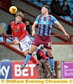 up and at ’em . . . Matt Palmer wins a header against Scunthorpe on Saturday.