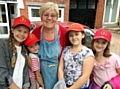 BABUSHKA . . . ‘grandmother’ Theresa Novotny with young visitors who came to Oldham last year (from left) Darya Harbunova, Hanna Savina, Dasha Pilipchuk and Anhelina Tarik