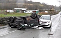 A Vauxhall Corsa lays on its roof after control was lost and it hit a stone wall at Well-I-Hole Road, Greenfield. 