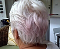 FROM white to pink . . . the 61-year-old believes the colour change in her hair was caused by using her new red bedding