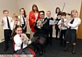 JOINING in: Oldham Mayor, Councillor Ateeque Ur-Rehman and Mayoress, Councillor Yasmin Toor, join Diggle School pupils (back, from left) Jack McQuillan, James Sleight, Carys Winskill, Billy Martin, Imogen Cox, George Redfearn and Sophie Hawes. Front: Poppy Blair