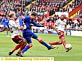 New loan signing Timmy Thiele forces his way into the Blades penalty box.