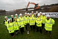 WORK under way . . . members of the Oldham and Royton project team celebrate the start of construction at Oldham wastewater treatment works as Simon Chadwick, United Utilities Wastewater Services Director, puts the first spade in the ground