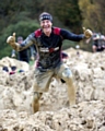 MUDDY marvellous — Steve Hill completes a gruelling obstacle course