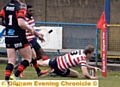 TRY TIME: Jon Ford crosses the line at the corner.
