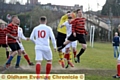 UP FOR IT . . . Oddies’ Danny Smith (stripes, right) goes for a header as John Gilder (far right) looks on.