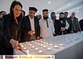 Candlelit vigil in memory of Lahore bomb blast victims: Debbie Abrahams MP lights a candle. Next to her is Abdul Basit Shah (Oldham Mosques Council) and Mufti Helal (officer for Oldham Mosques Council). 