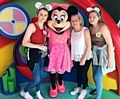 CENTRE OF ATTENTION: Bethan with her mum and sister Helen and Sophie Curran with Minnie Mouse