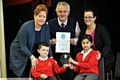 AWARD . . . Julie Slattery (teaching assistant), Stuart Vaughan (Diabetes UK) and Debbie Bardsley (medical needs co-ordinator) with Rocque Prescott and Ayesha Javid