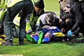 BRIAN Wilson being attended by medical staff at Barnsley.