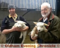 LAMBING season...Darren Hough with his father Bryn and some of the new borm lambs.