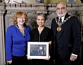 AWARD: Sue Devaney receives her award from the Mayoress of Rochdale, Councillor Cecile Biant, and the Mayor, Councillor Surinder Biant.