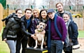 Dogs Trust Manchester’s Rocky was happy to take centre stage when Hayley Tamaddon (fourth from left) and actor Joe Tracini (third from right) and friends from the “Chicago” cast visited the rehoming centre. Picture by Lovatt Photography.