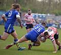 GROUNDED: Phil Joy heads for the floor during Oldham’s defeat to Warrington. 