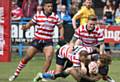 DOWN YOU GO . . . Steven Roper and Gary Middlehurst bring down their Leigh rival at Bower Fold.