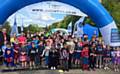 KEEPING FIT . . . children take a break at the finishing line at the Alexandra parkrun.