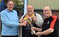 HANDOVER . . .Geoff Cooke, chairman of Rugby Oldham, presents the Rugby Oldham Challenge Trophy to David Hughes (centre), head coach of Fitton Hill, and club chairman John Hughes.