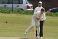 Umpire Craig Ramadhin looks on as Heyside skipper Ryan Barnes strives for a wicket against Austerlands in the Wood Cup