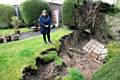 Sharon Curley in the back garden of her mother's house, part which has vanished in a land slide. 