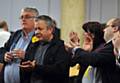 VETERAN Lib-Dem Councillor Howard Sykes (left) gets applause from Councillor Chris Gloster and other supporters after retaining his Shaw seat.
