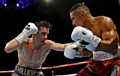 Anthony Crolla (left) and Ismael Barroso during the WBA World Lightweight Title bout at the Manchester Arena. 