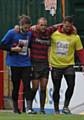 HELPED OFF . . . Oldham half-back Steve Roper exits the field