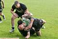 Harry Aaronson, of Saddleworth Rangers, feels the force of a Stanningley tackle.