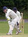 SHAW'S Tom Needham plays the ball off the front front in yesterday's Tanner Cup tie at Hollinwood. Shaw won on the toss of a coin after rain stopped play