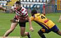 STEPPING IN . . . Young centre Sam Wood tries to skip beyond a tackle